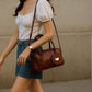 Mahogany Charm – Double-Zip Leather Tote with Smiling Petal Detail